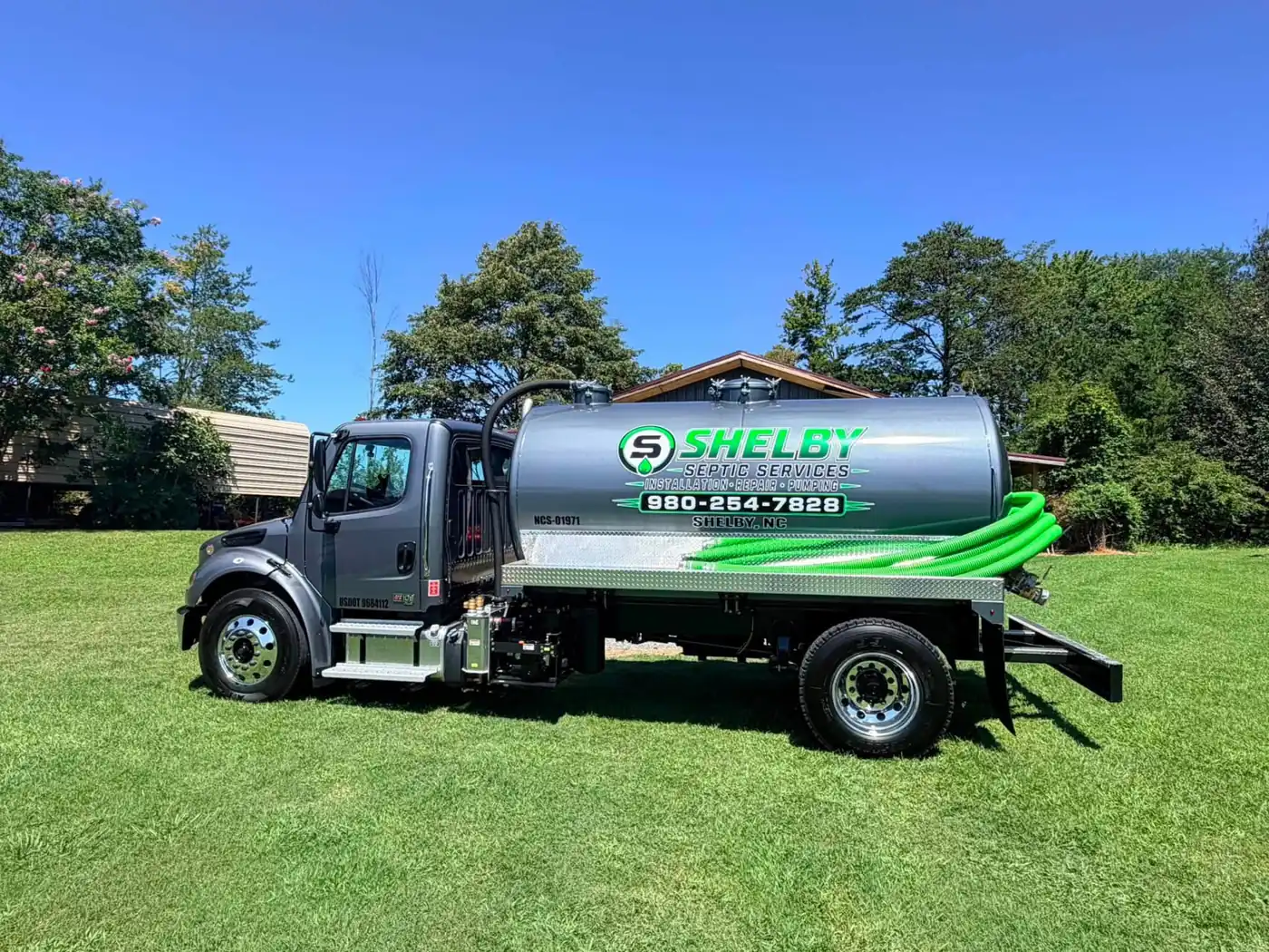 Shelby Septic Services pump truck parked on a lawn in Shelby, NC