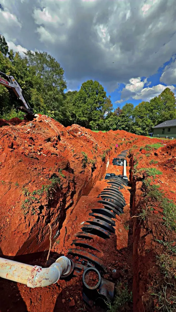 Drain field chambers set in an open trench during a septic installation in Shelby, NC